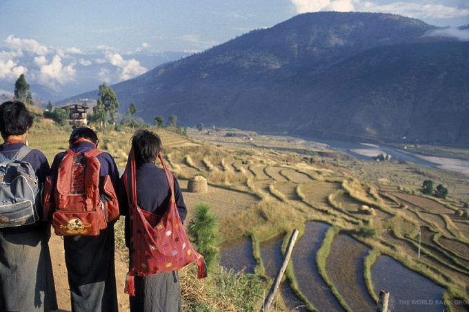 Children looking out on terraced fields. Bhutan. Credit: Curt Carnemark / World Bank
